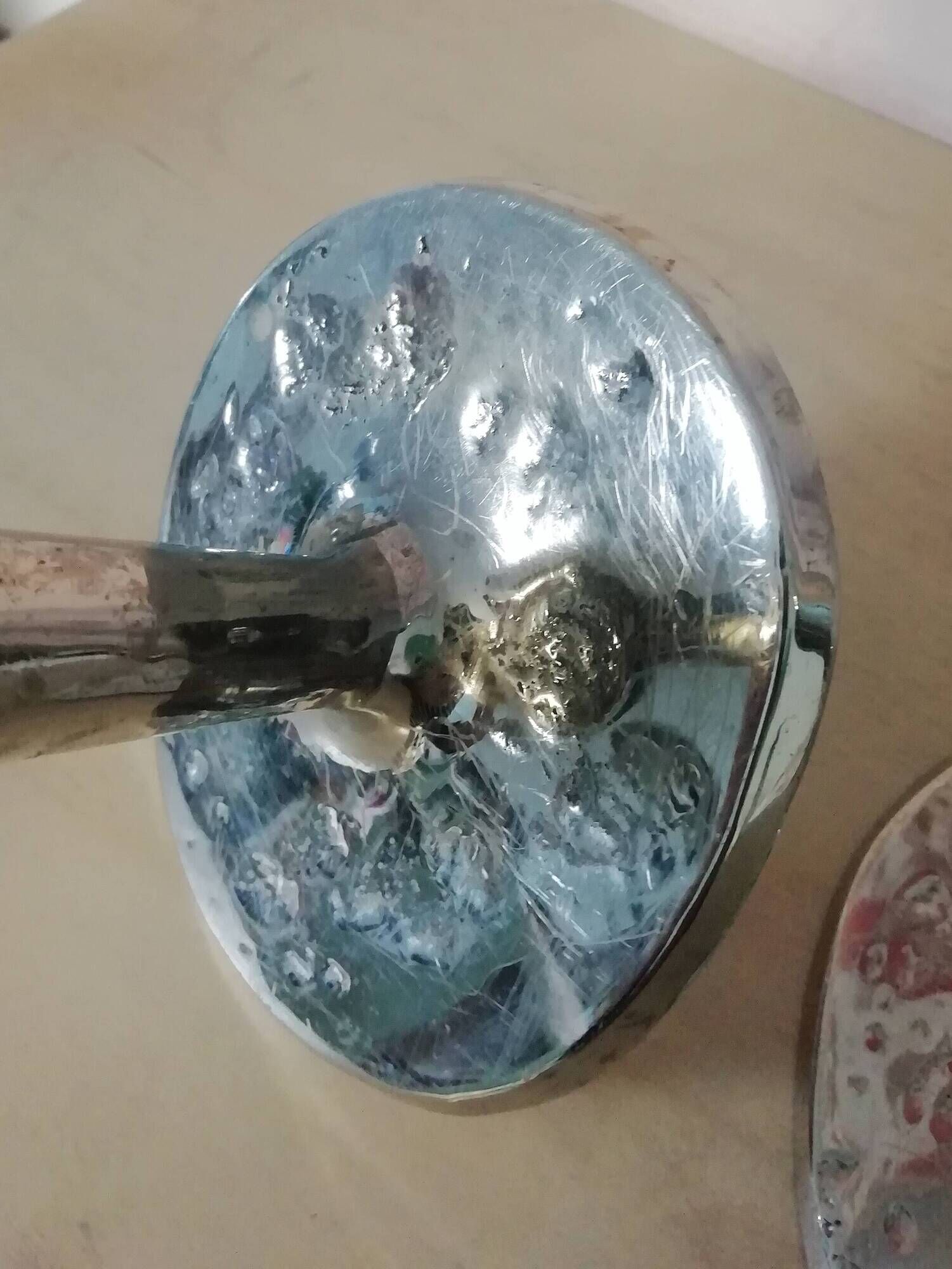 Pair of hammered metal candlesticks