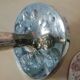 Pair of hammered metal candlesticks