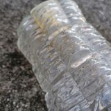 Duo of vintage molded glass globe pendant lights.