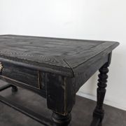 Louis XIII style desk in blackened wood with turned legs and two drawers.