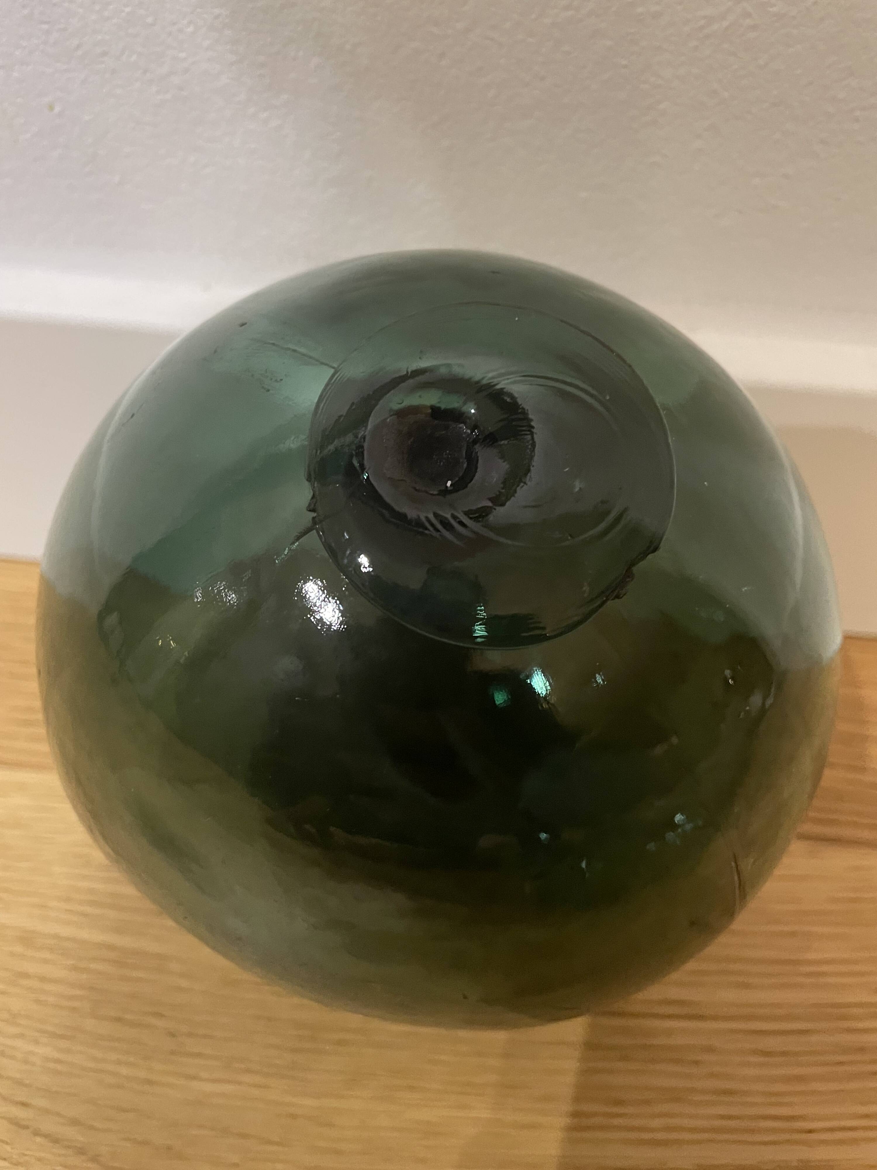 Floating fishing ball in glass