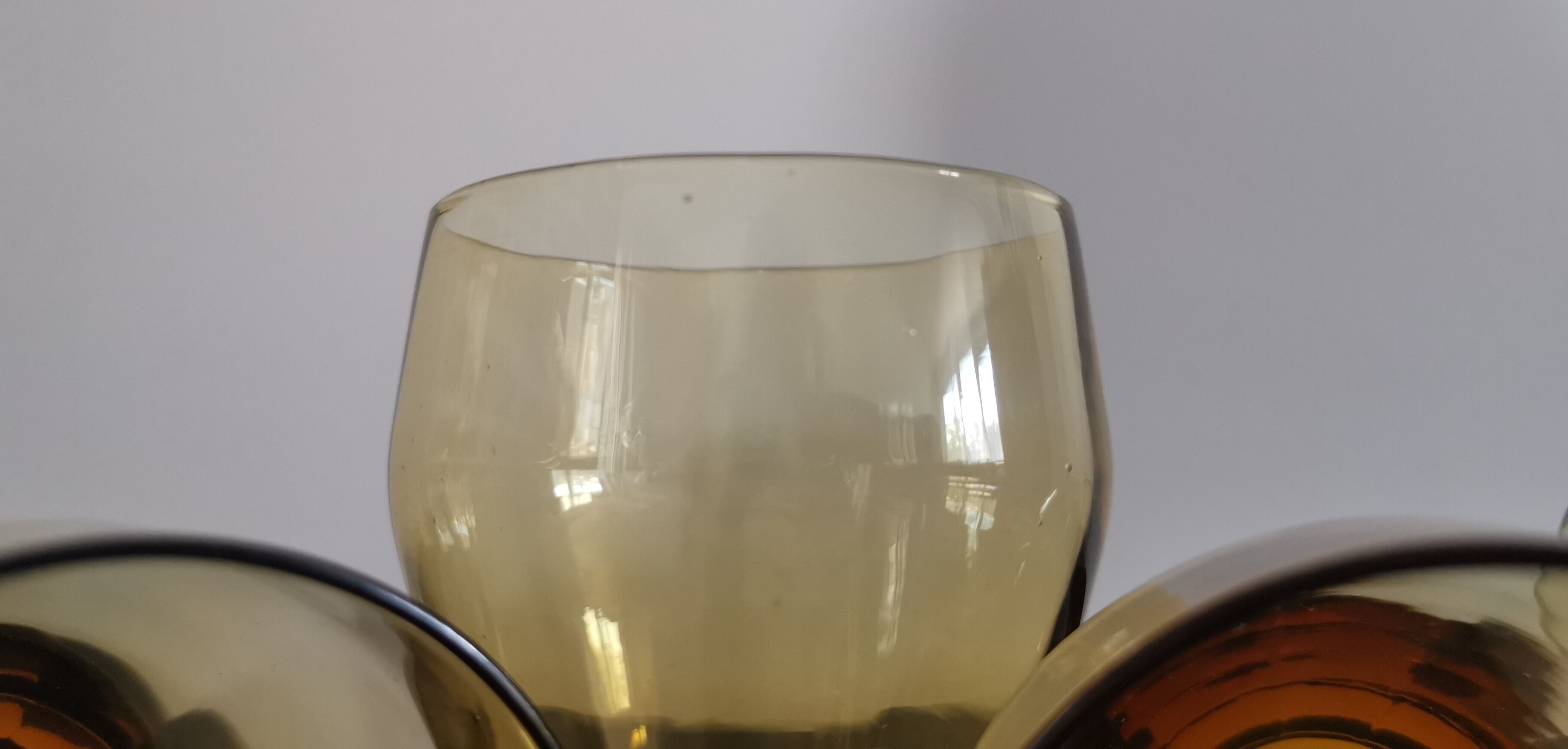 4 old amber colored glasses