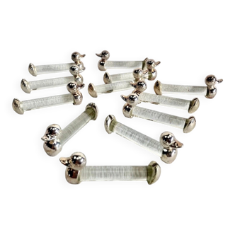 12 silver-plated metal duck knife rests with crystal.
