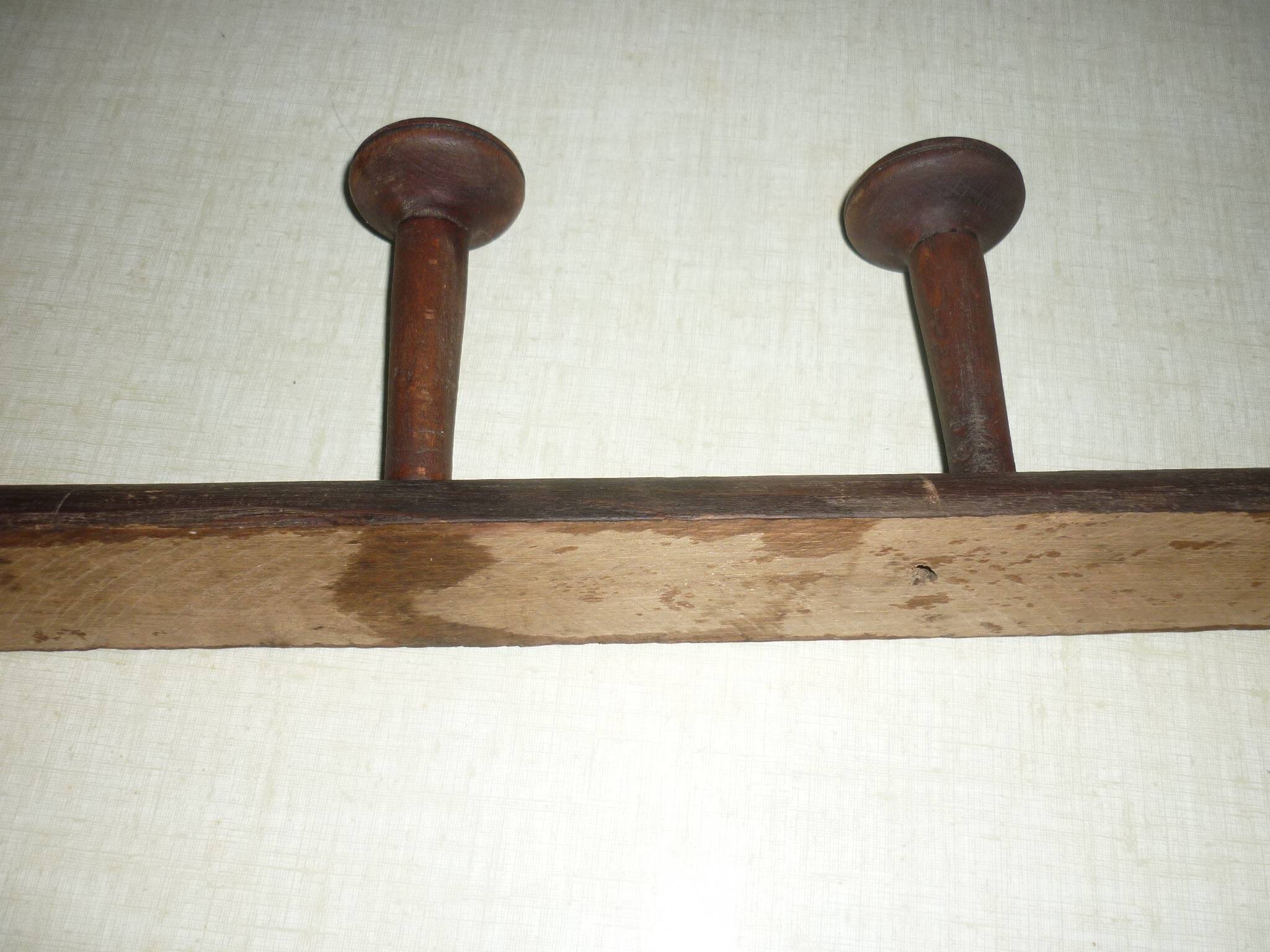 Wooden wall-mounted coat rack