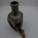Vintage decanter in glass and tin.