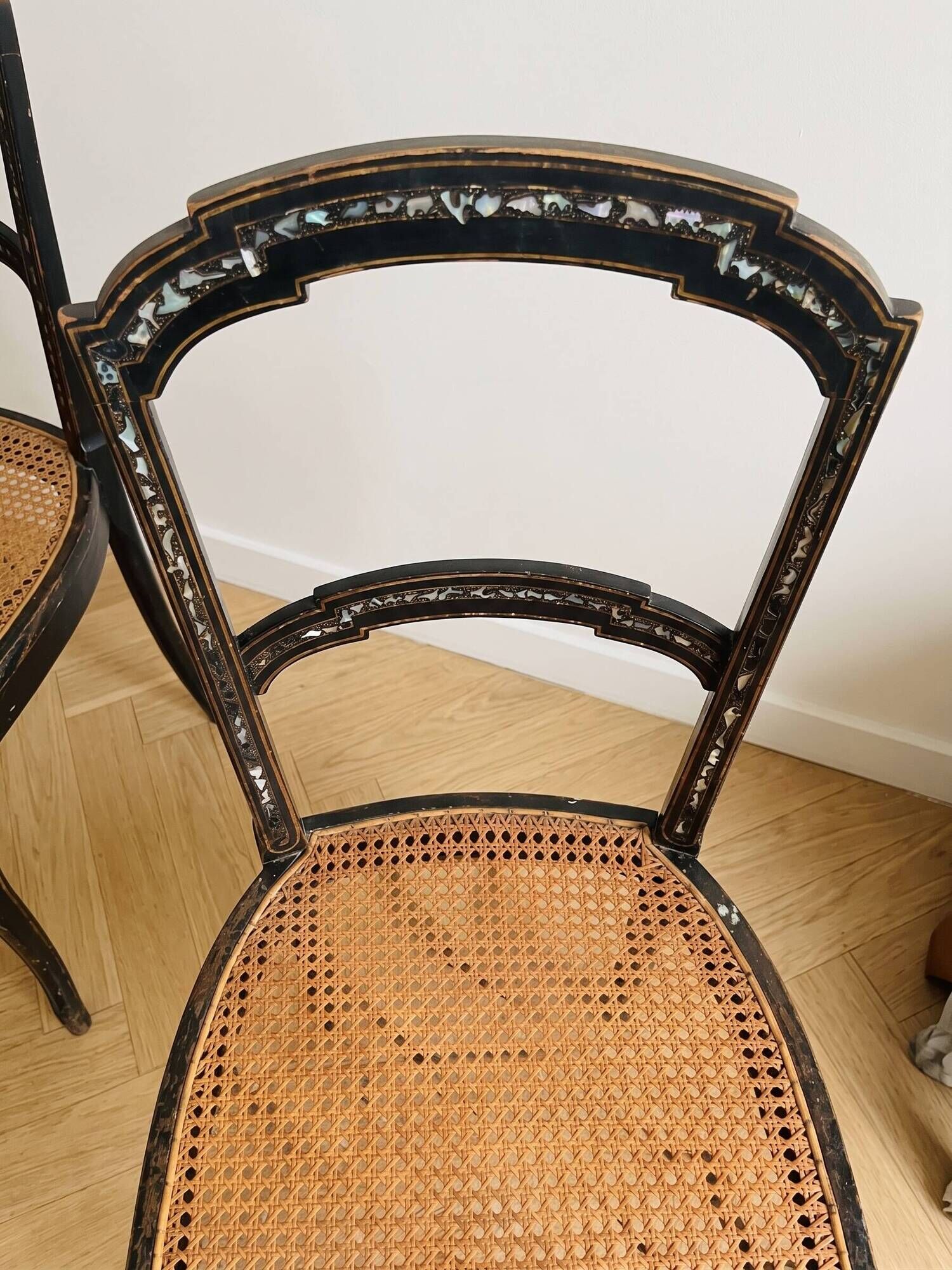 Set of 2 antique chairs in blackened wood and caned.
