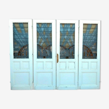 Suite de quatre portes de séparation en vitrail Art Déco XX siècle