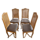 Four antique chairs in classic style with caning and upholstery.