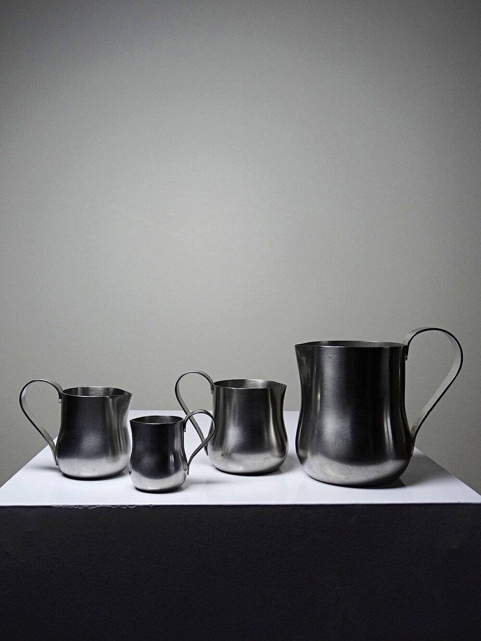 Set of 4 vintage bar measures in brushed stainless steel from the 60s-70s.