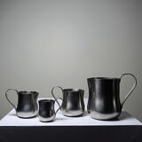 Set of 4 vintage bar measures in brushed stainless steel from the 60s-70s.