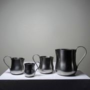 Set of 4 vintage bar measures in brushed stainless steel from the 60s-70s.