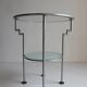 Postmodern round glass  and steel side table, 1980s.
