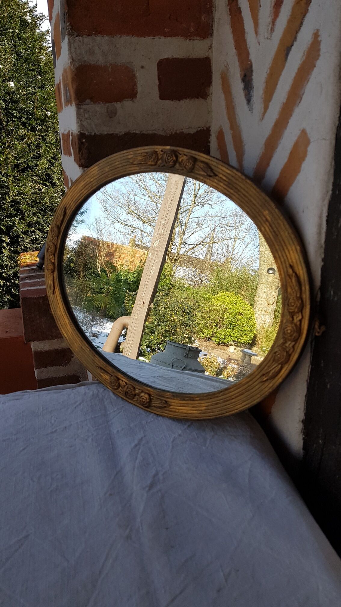 Art Deco golden oval mirror