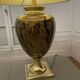 Bronze table lamp with a golden shade.