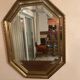 Octagonal mirror with gilded wooden beaded borders