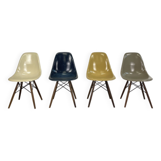 Eames Herman Miller DSW side chairs in navy blue, light greige, light ochre and parchment with sligh