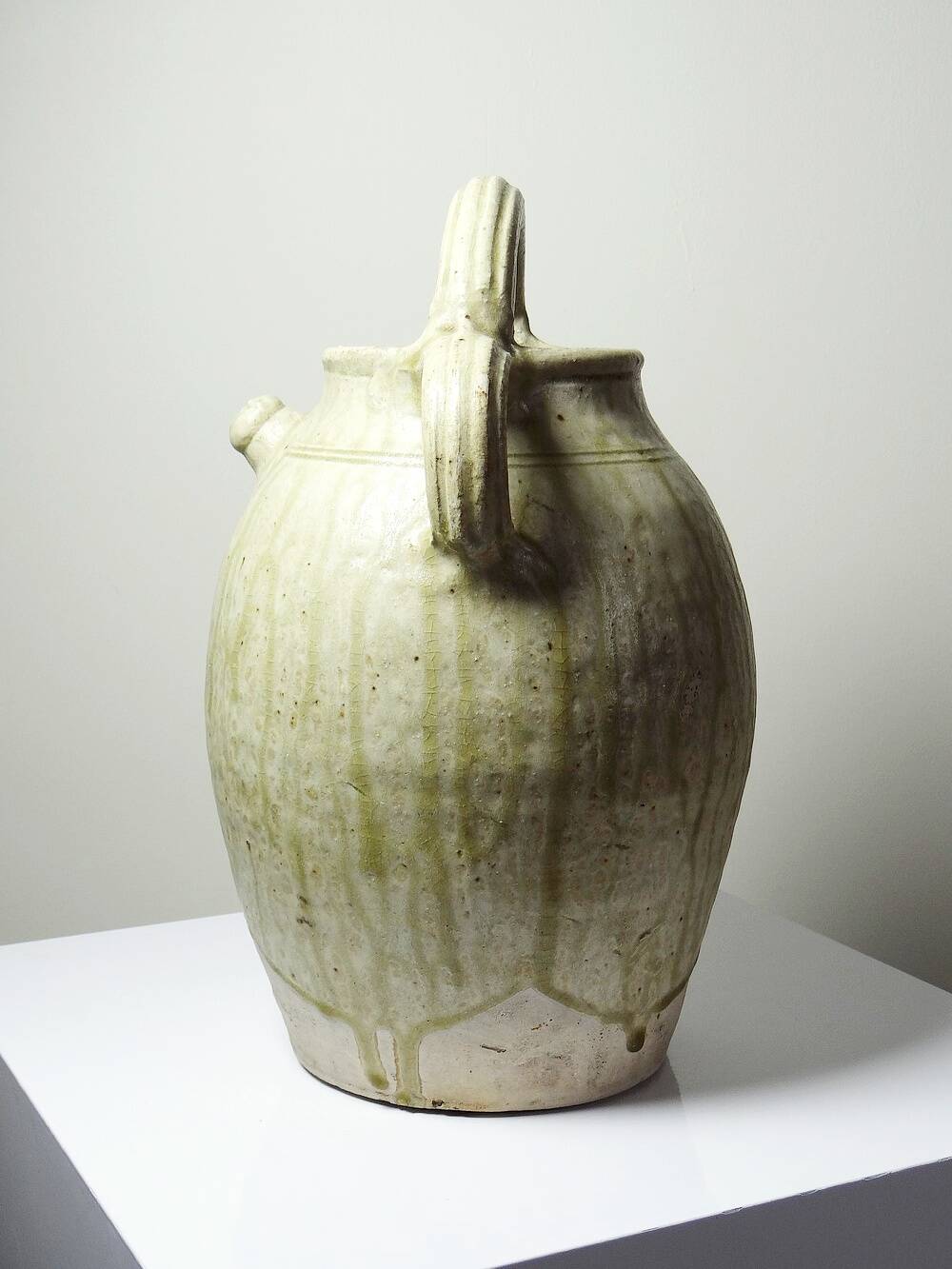 Green ash-glazed stoneware casserole from Puisaye, late 19th to early 20th century.
