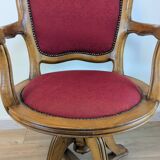 Vintage captain's chair in wood and garnet fabric — a seat with character