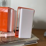Pair of orange plexiglass wall sconces from the seventies.