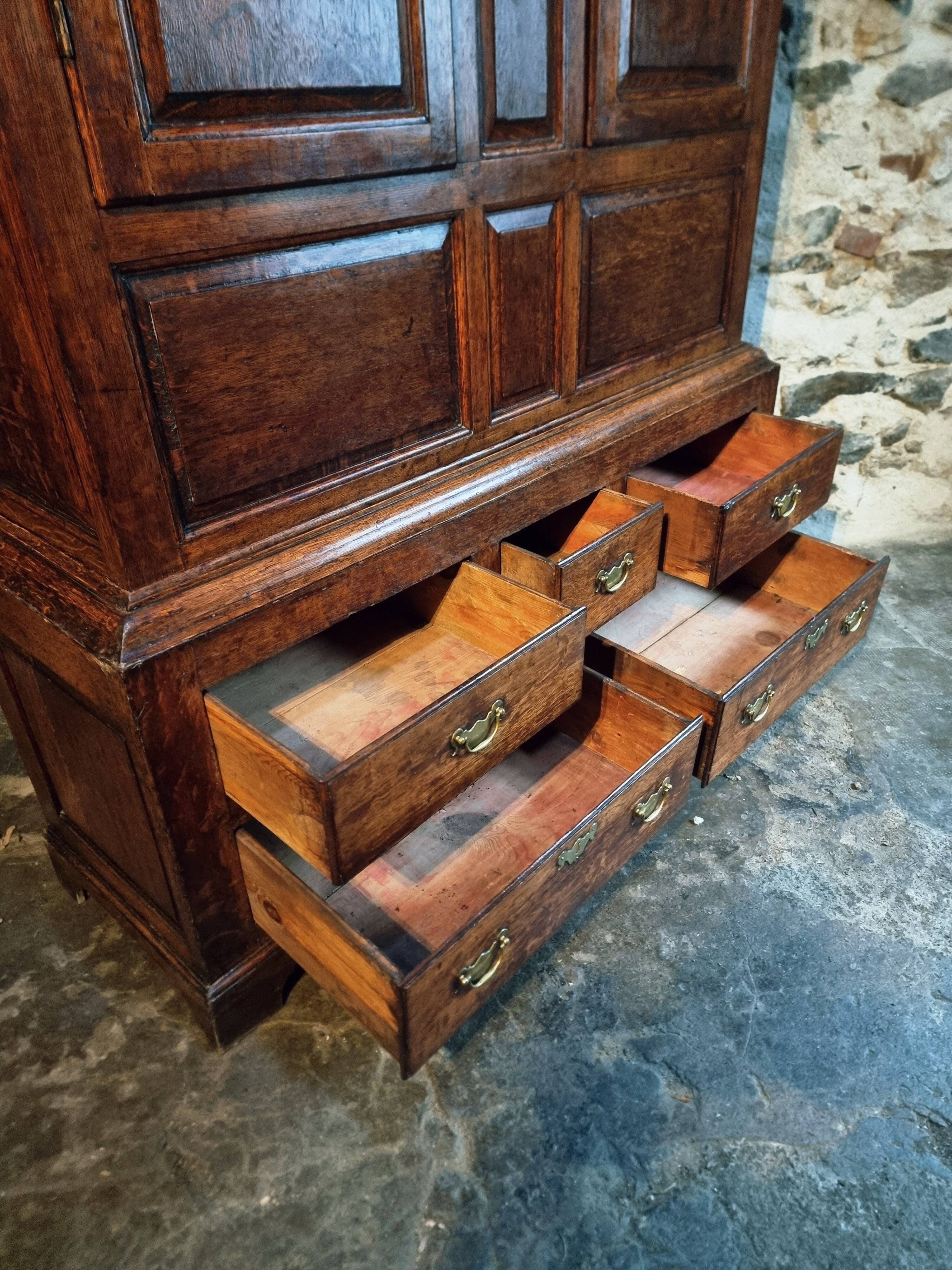 Antique English oak wardrobe with drawers, England, circa 1800–1820.