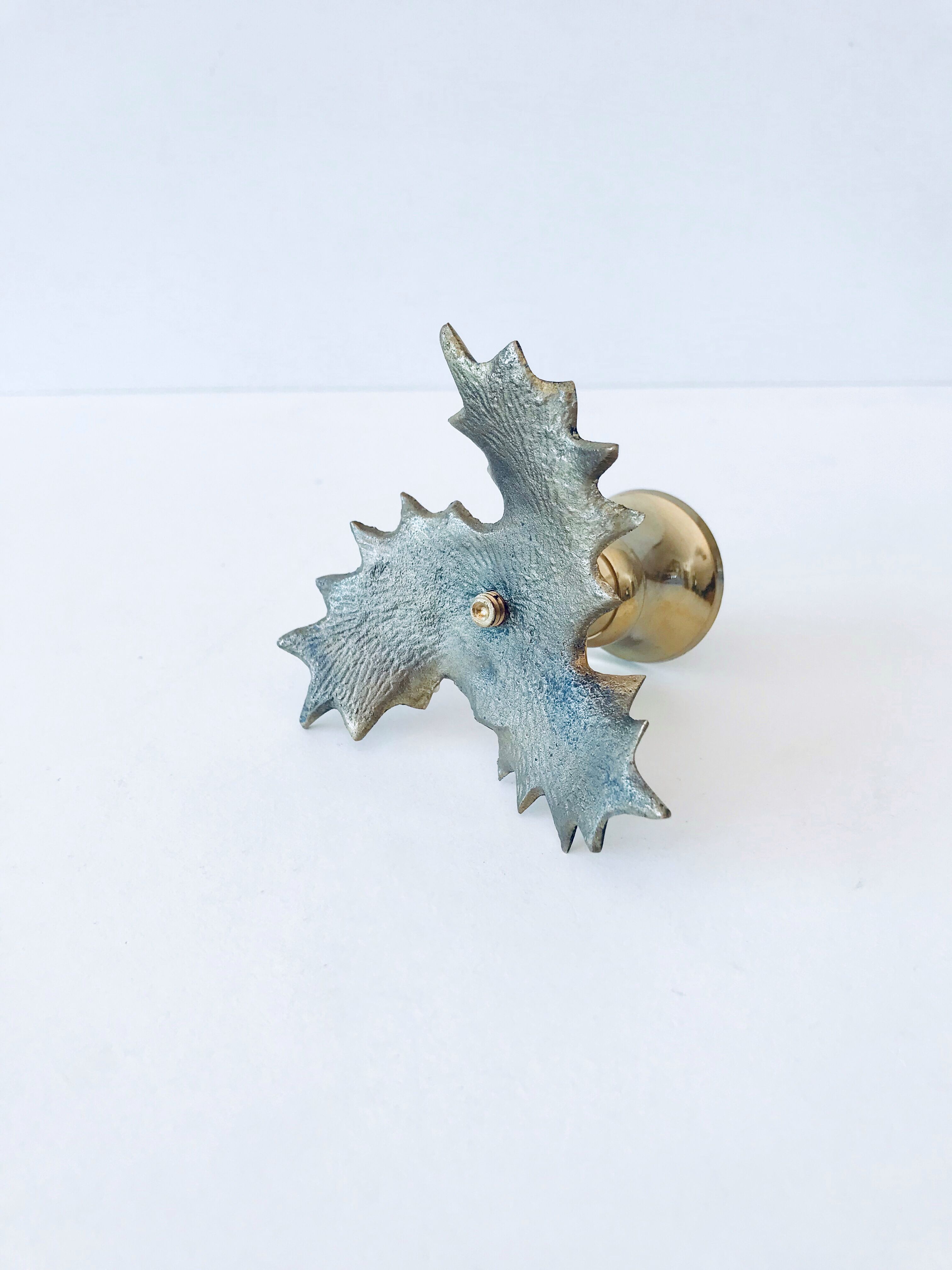 Candlestick in brass holly design