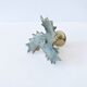 Candlestick in brass holly design
