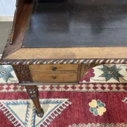 Louis XVI style desk from the late 19th century in walnut with a leather top.