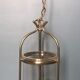 Lanterne cage deux feux verre cylindrique translucide et laiton à trois pieds - style classique