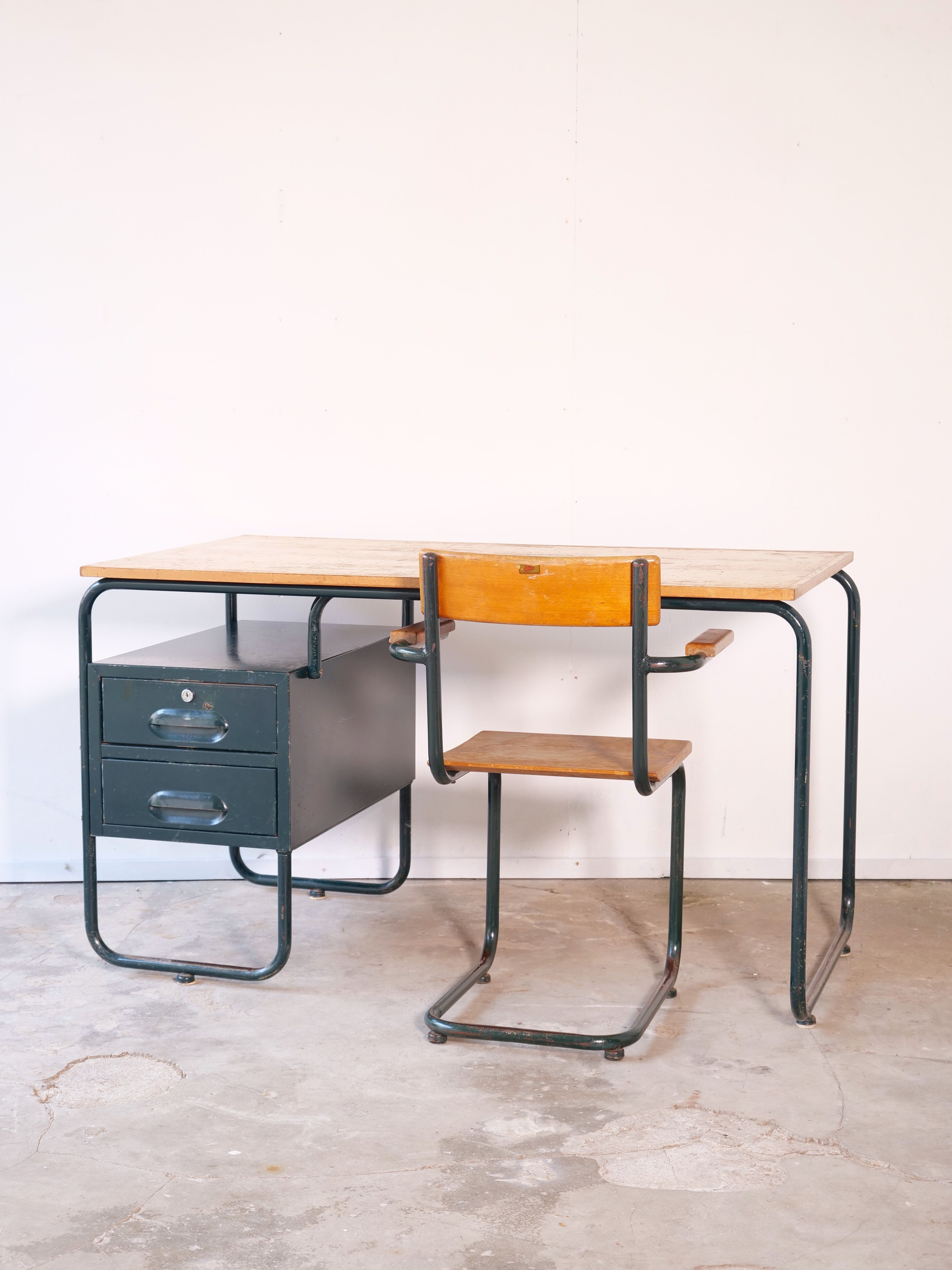Desk with bauhaus style tubular steel chair