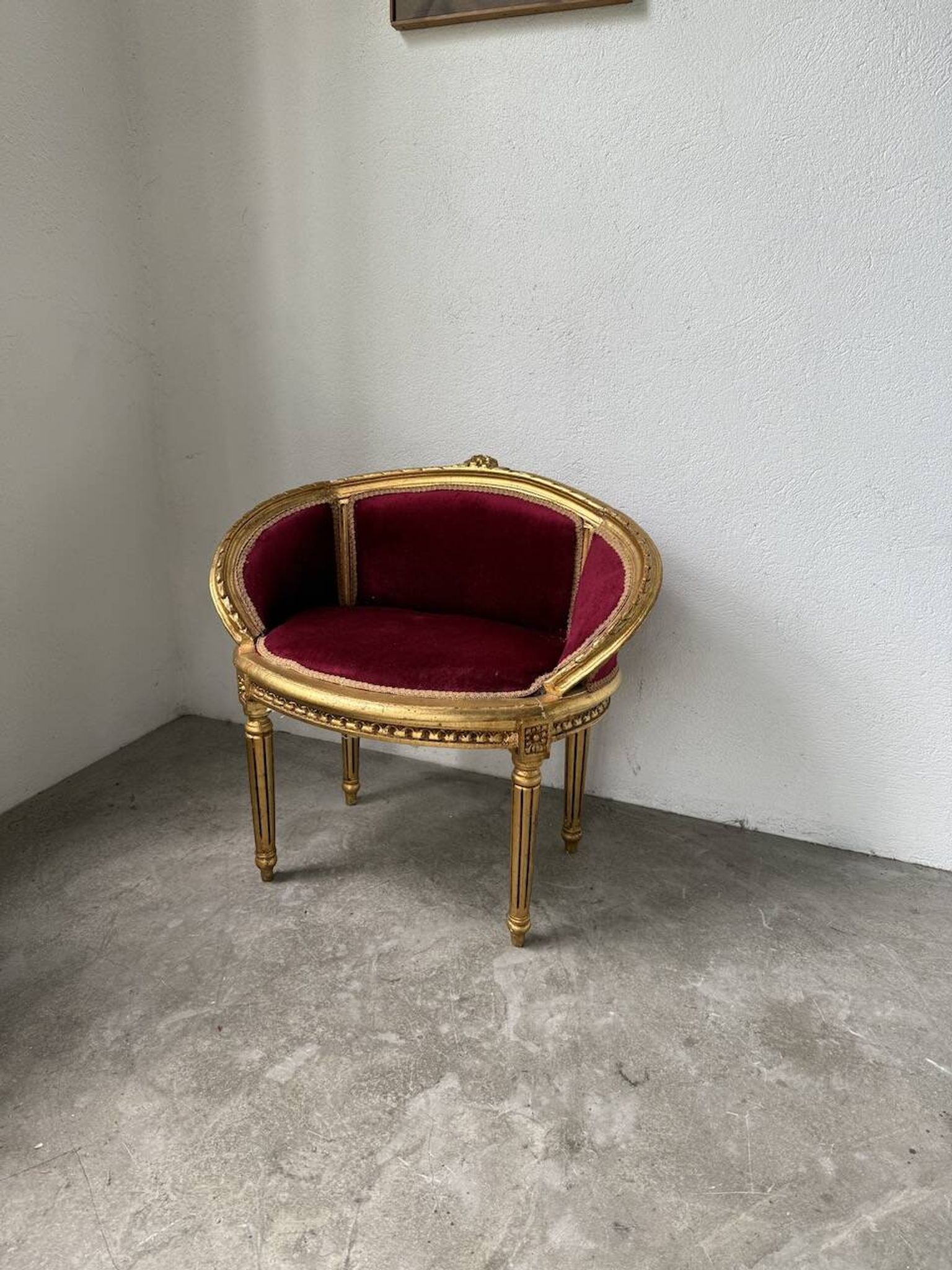 Louis XVI gilt wood and red velvet armchair