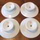 Set of 4 porcelain display cups of the depot rue Drouot in Paris