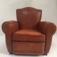 Large club chair in cognac leather