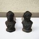 Old cast iron andirons: bust of a woman with a medallion