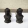 Old cast iron andirons: bust of a woman with a medallion