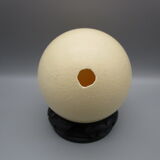Ostrich egg on pedestal