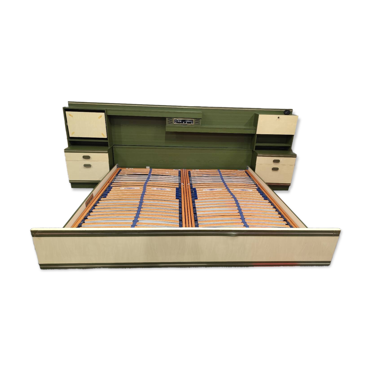 Vintage king-size bed with headboard furniture and built-in radio.