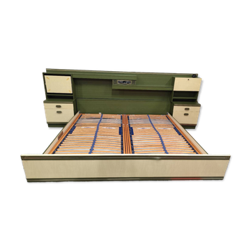 Vintage king-size bed with headboard furniture and built-in radio.