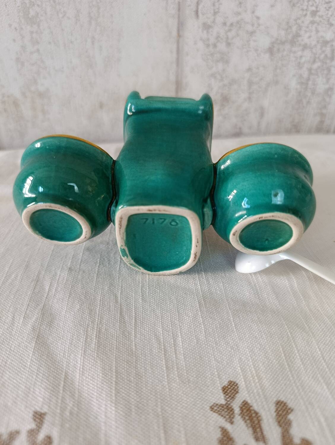 Mustard and salt pepper shaker in the shape of a toilet.