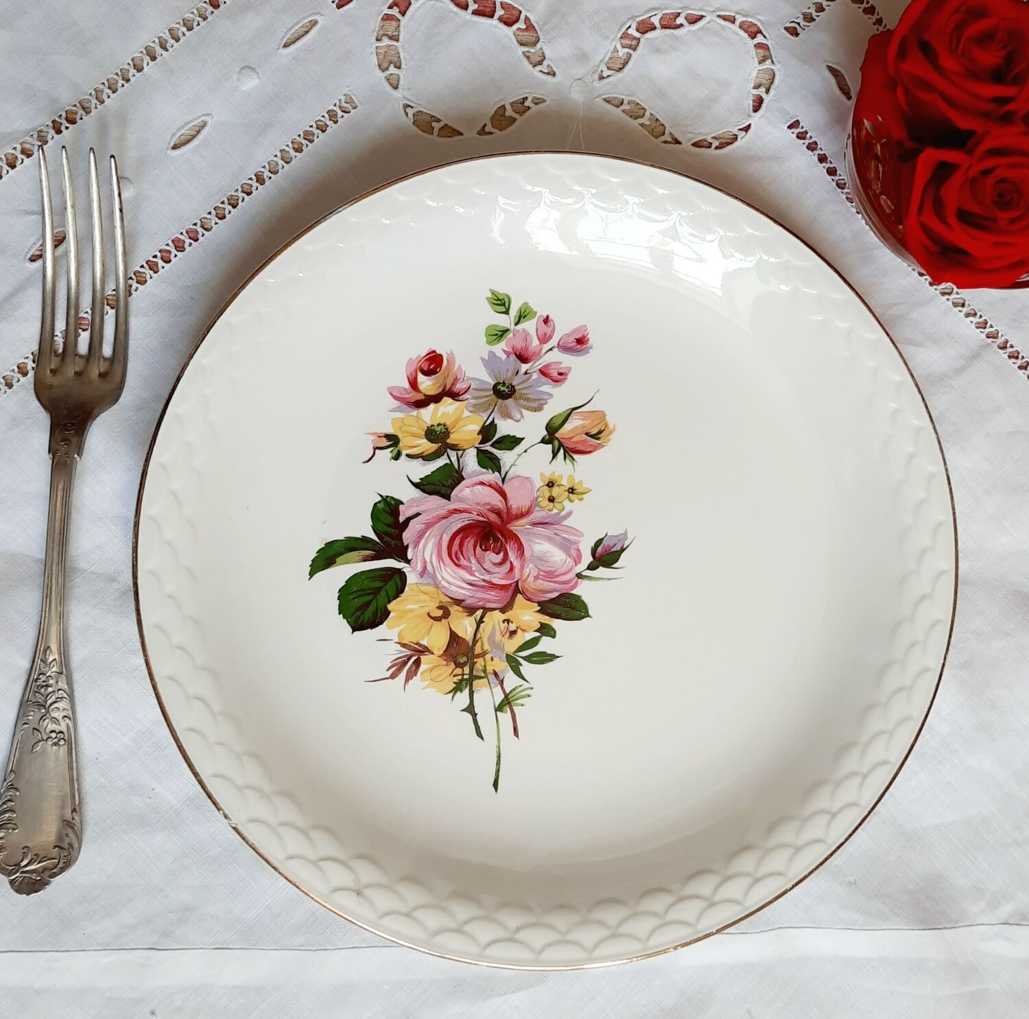 Flat antique earthenware plates with gilded edges