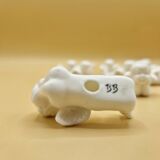 12 porte-couteaux vintage en porcelaine figurant des chérubins