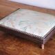Small antique wooden and fabric footrest.