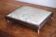 Small antique wooden and fabric footrest.