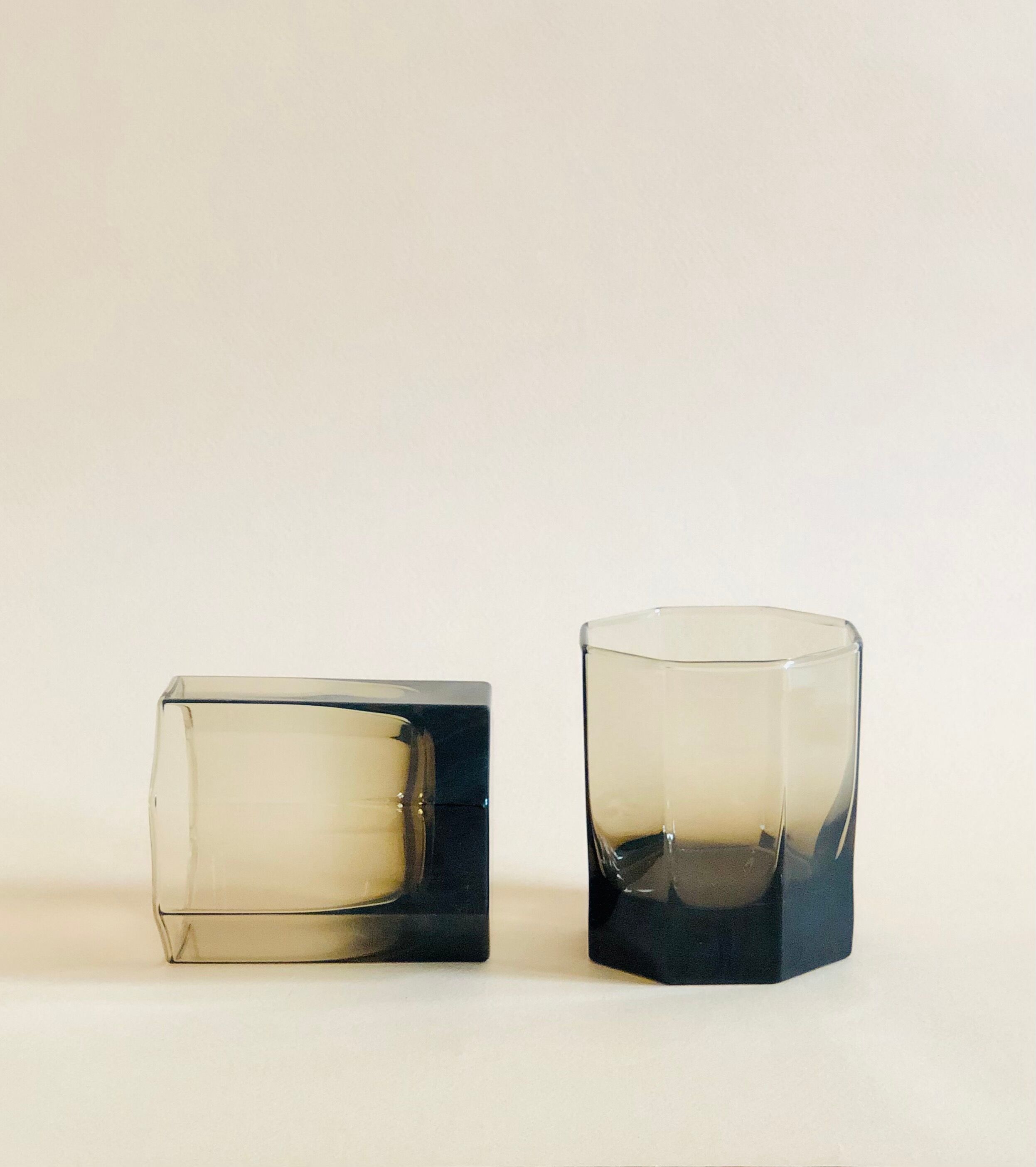 Pair of octagonal black glass whiskey glasses
