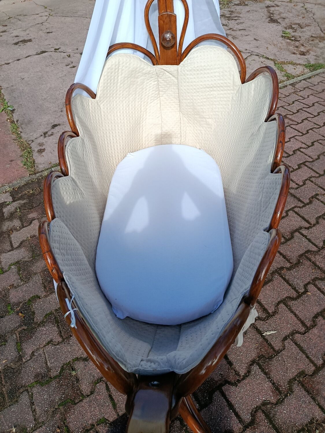 Antique cradle by J&J Khon