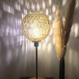 Table lamp with an antique vintage gold globe, mounted on a gold base