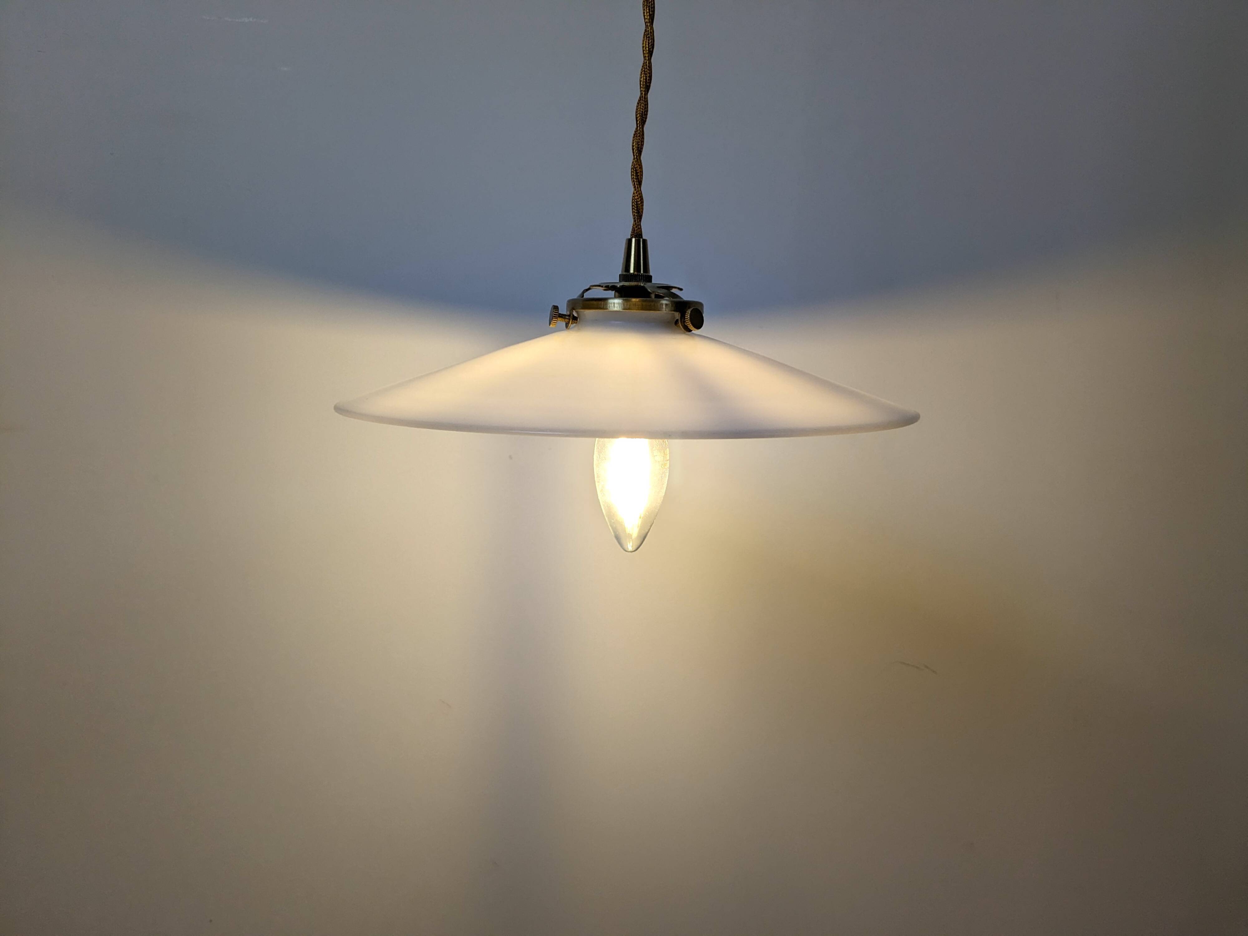 Vintage suspension in white opaline, elegant light fixture with soft light.