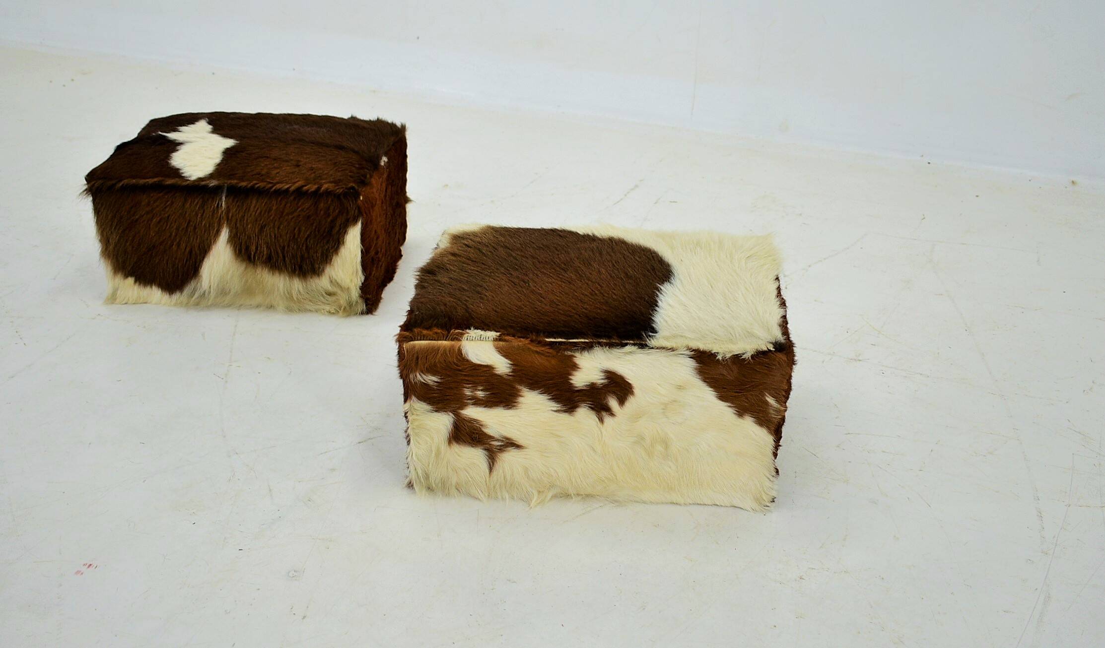 red brown leather cowhide footstools , poufs, 80s