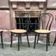 Two pairs of black 50s chairs - number 18 - cannée