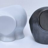 Two iridescent black and white ceramic elephants design