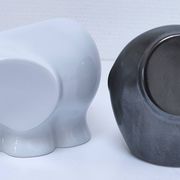 Two iridescent black and white ceramic elephants design